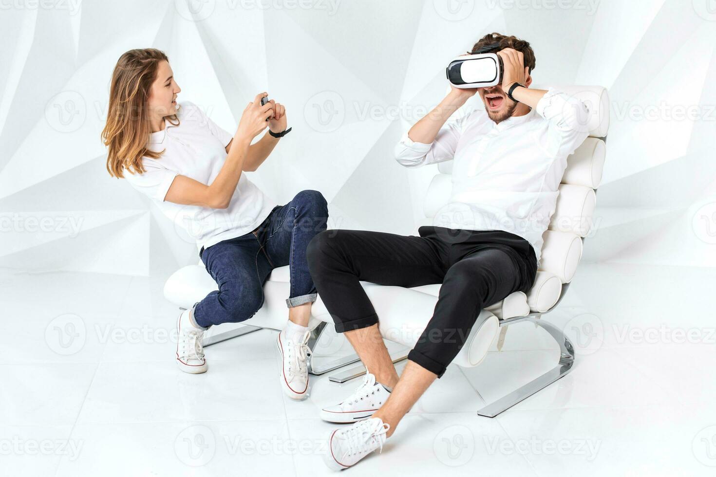 Couple having fun playing with virtual reality photo