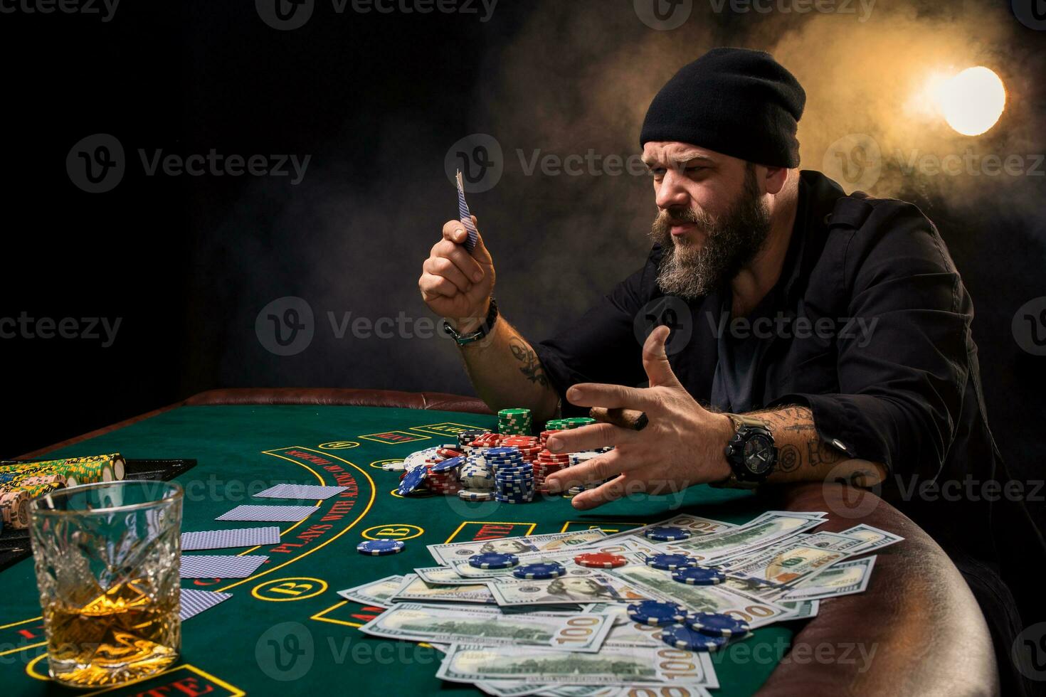 Man is playing poker. Emotional fail in game, game over for card player, man very angry with foolish choices, losing all the chips on bank. photo