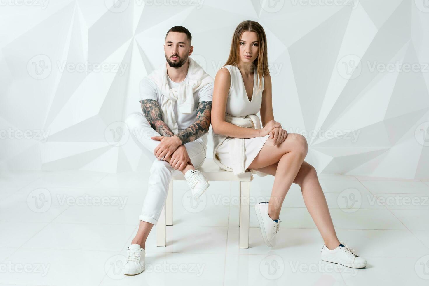 Shot of a fashionable couple posing at studio. photo