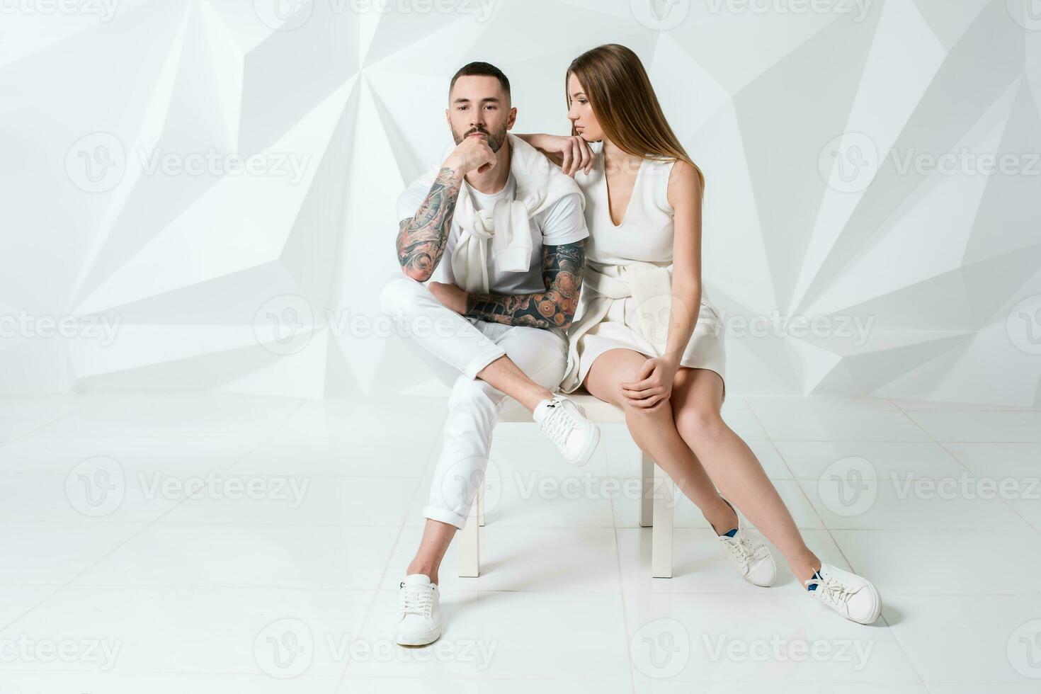 Shot of a fashionable couple posing at studio. photo