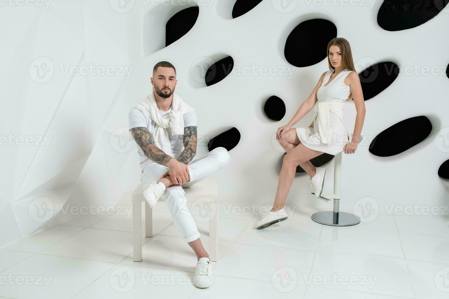 Shot of a fashionable couple posing at studio. photo