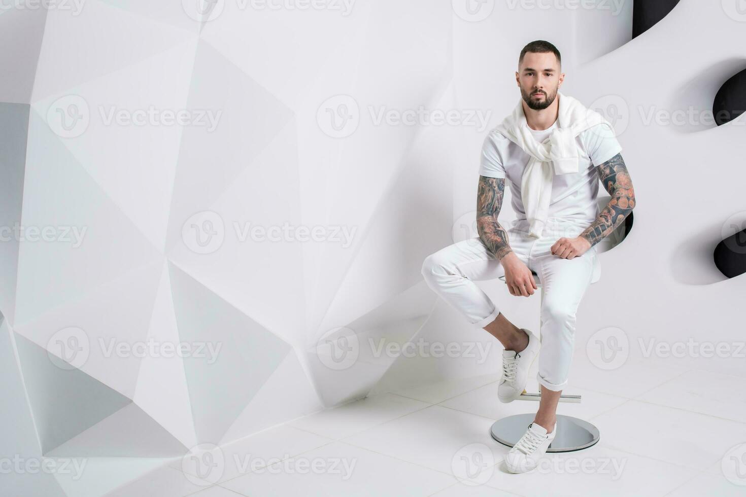 Handsome man wearing pants and white t-shirt photo