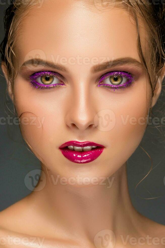 Beauty woman face closeup isolated on black background. Beautiful photo