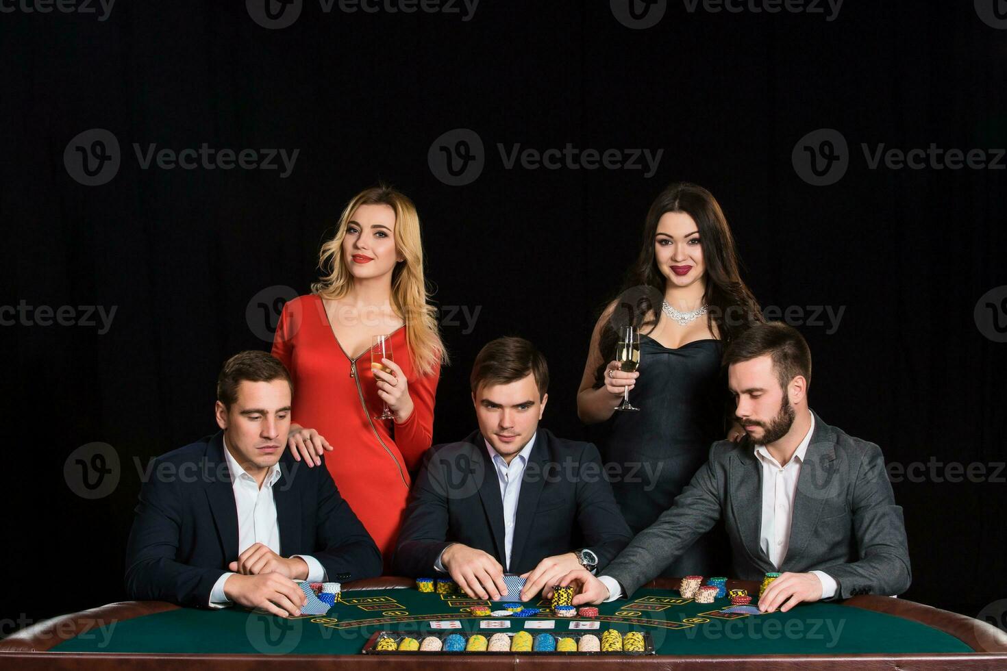 People at the poker table in casino photo