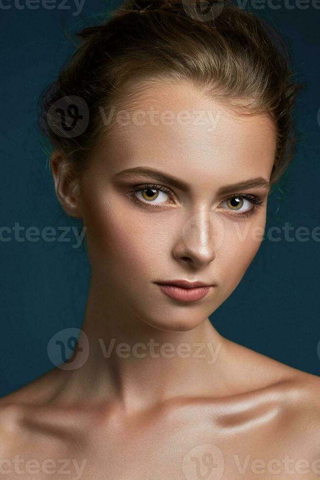 Beauty woman face closeup isolated on black background. Beautifu photo