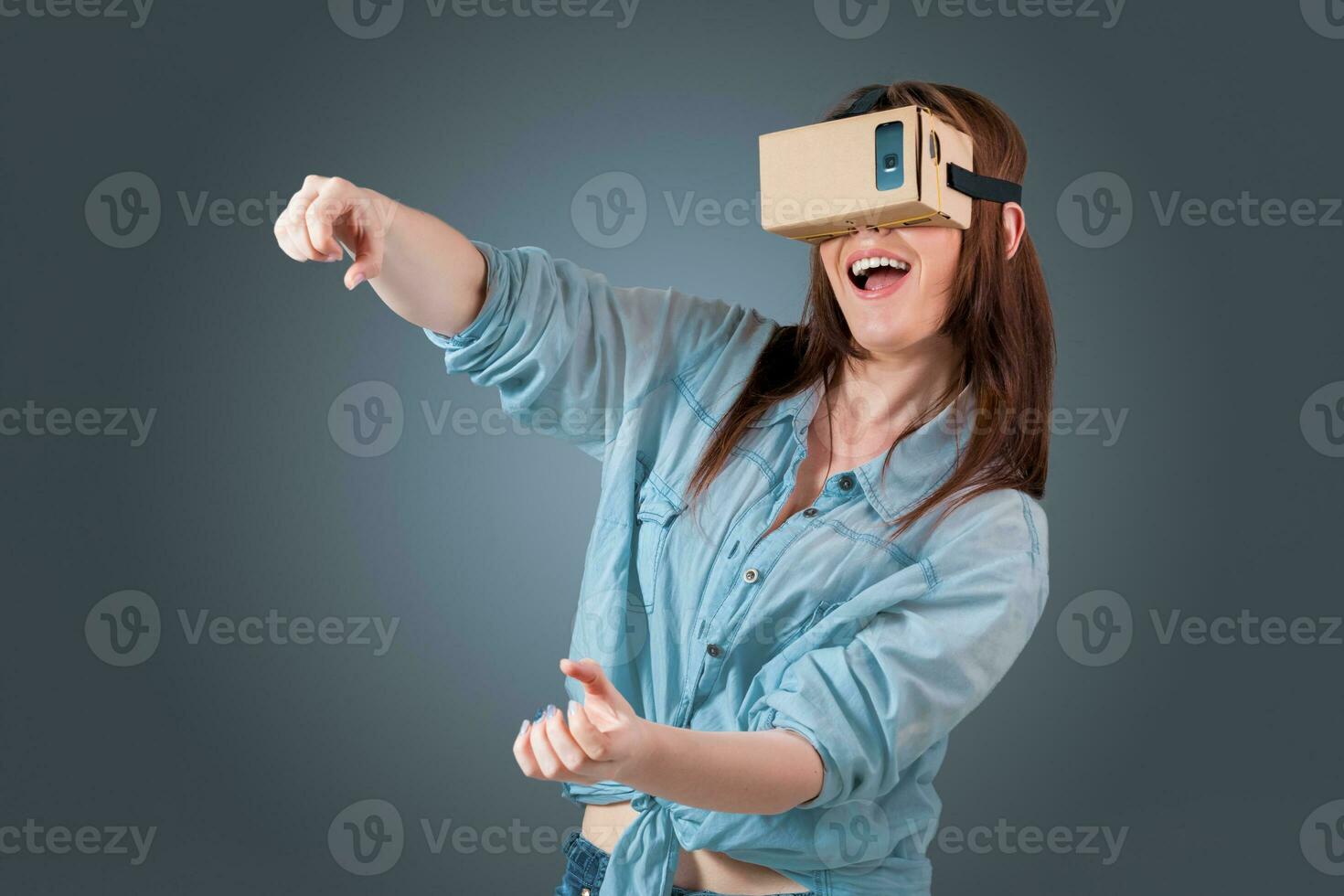 young woman using a VR headset glasses photo