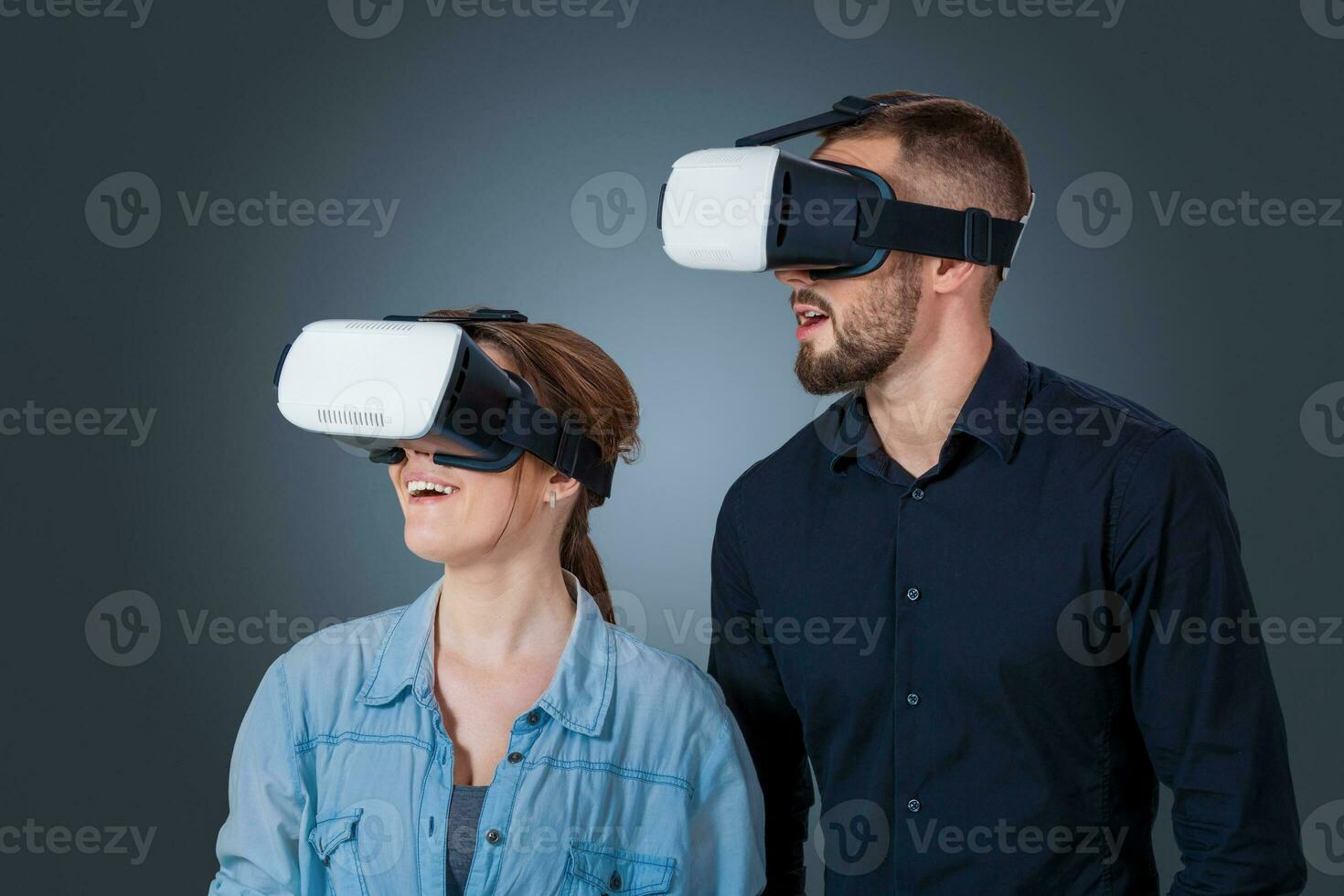 young couple using a VR headset glasses photo