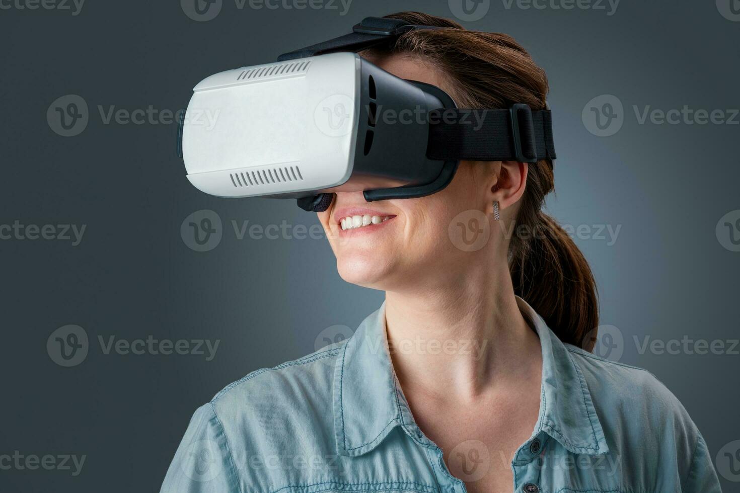 young woman using a VR headset glasses photo