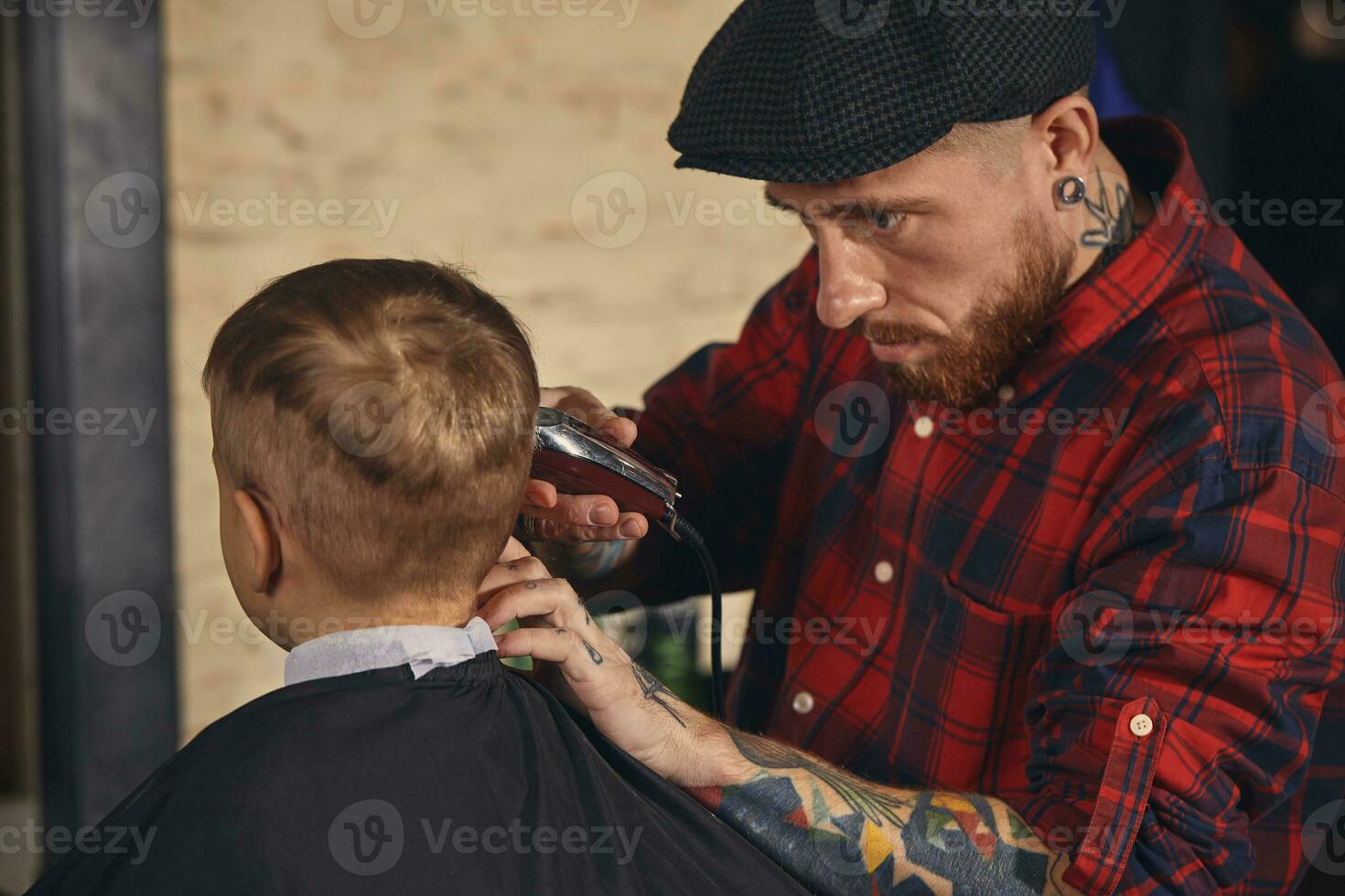 Caucasian boy getting haircut in barbershop indoor photo