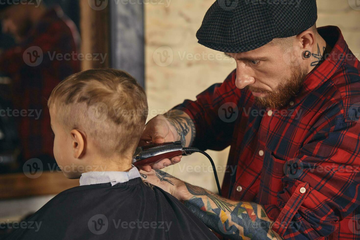 Caucasian boy getting haircut in barbershop indoor photo