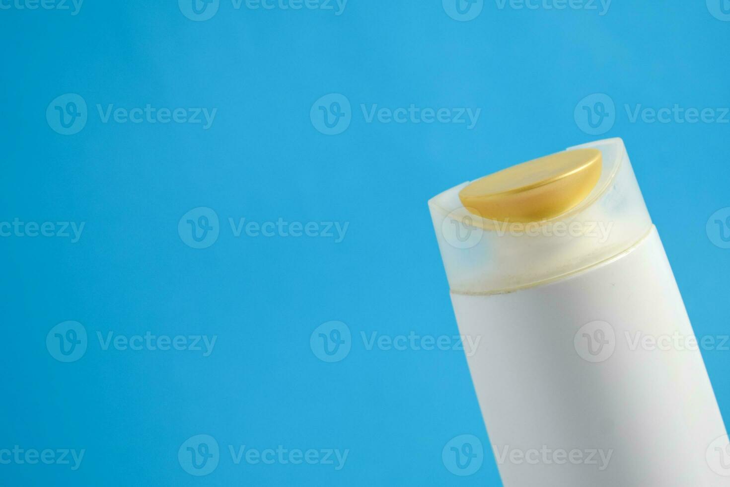 White Bottle shampoo blank for mock up with blue background, beauty health care mockup bottle. photo