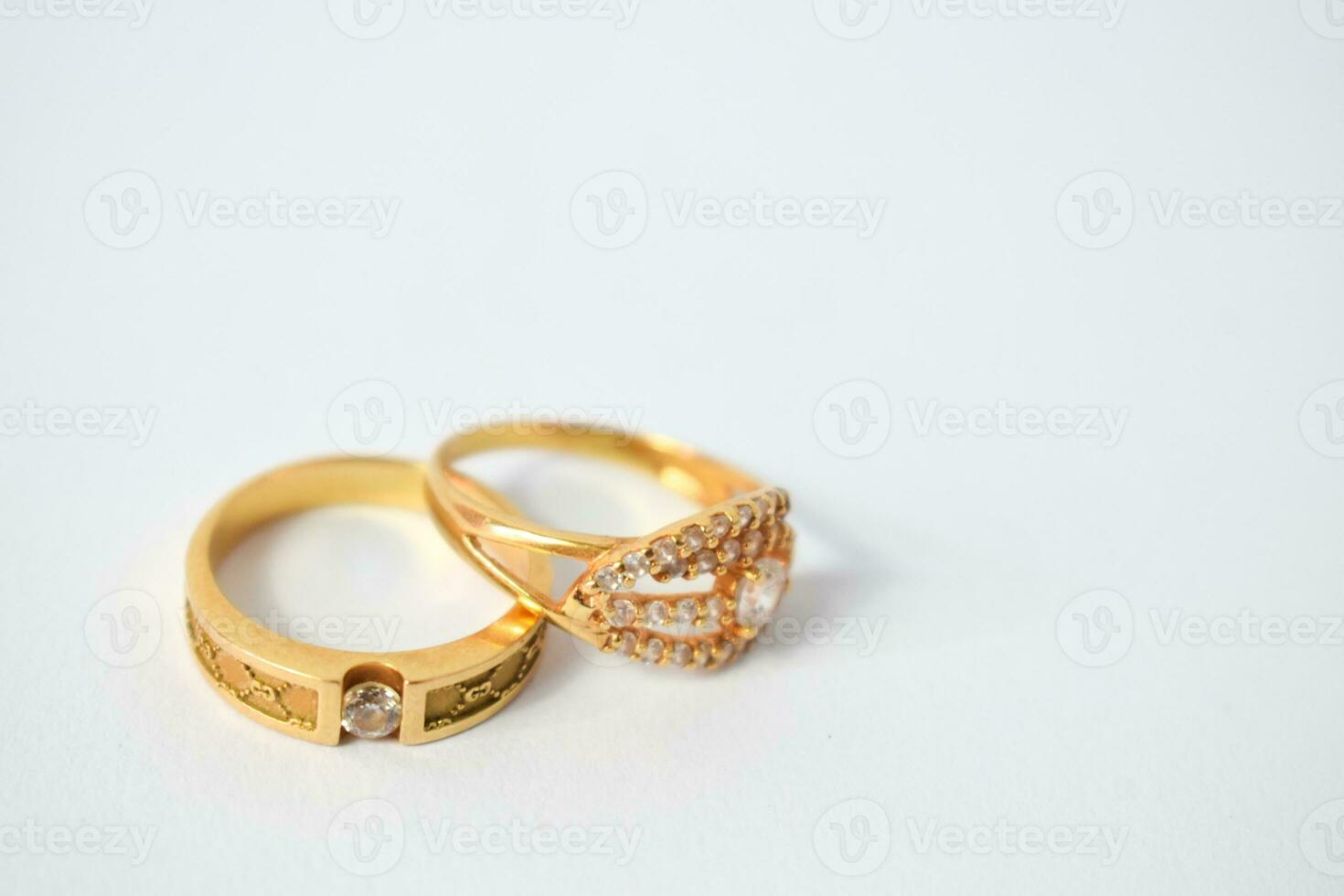 Close Up Golden ring with diamond on isolated white background photo