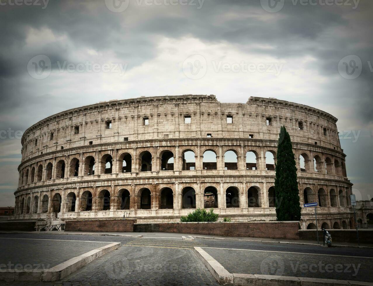 Gray clouds over Colosseum photo