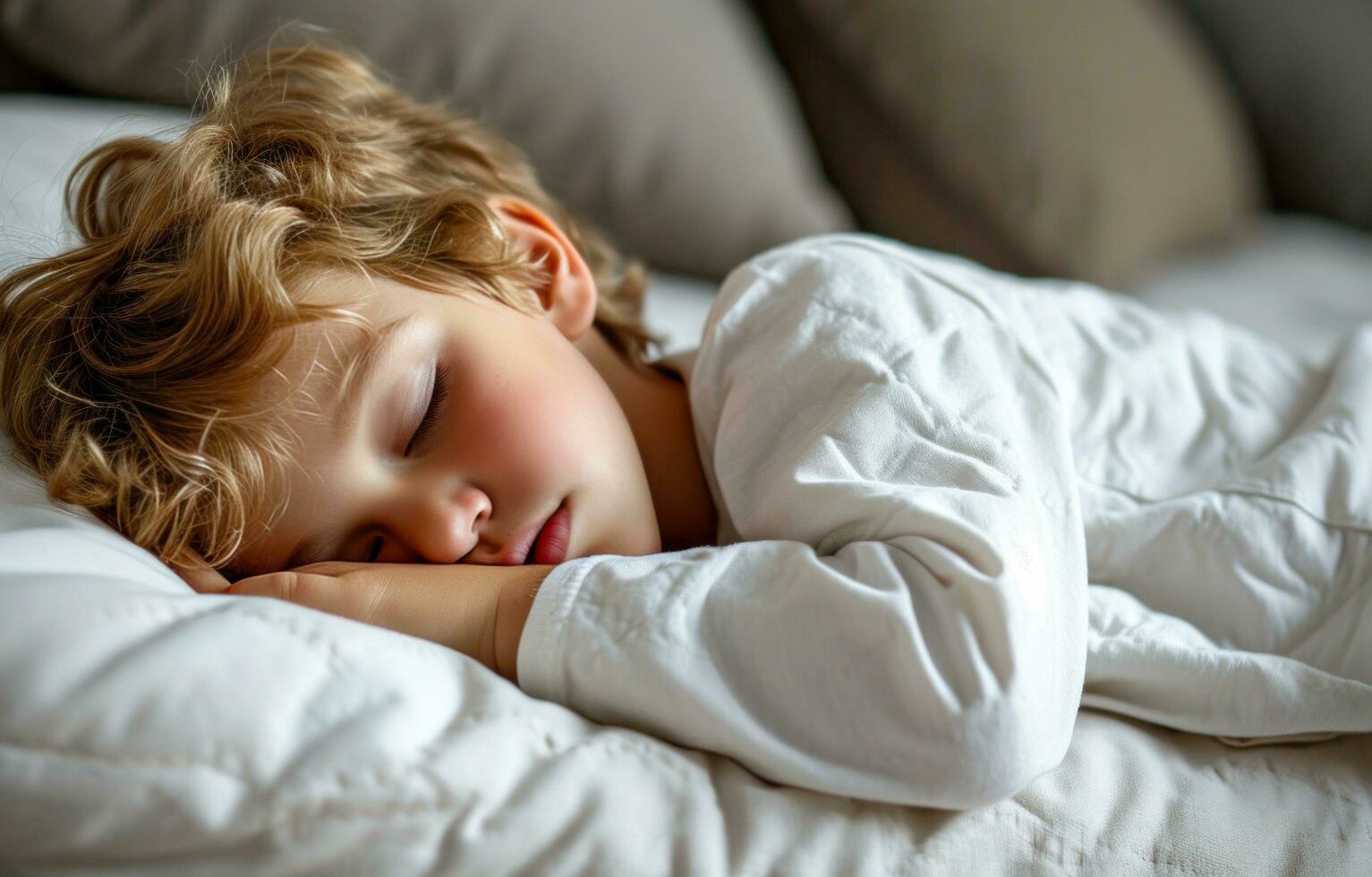 AI generated a small boy sleeping on a white pillow photo