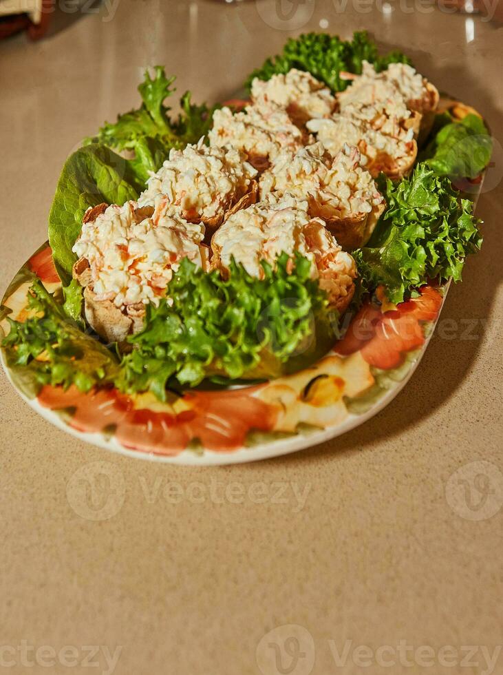 Delicious Homemade Salad with Crab Sticks and Fresh Lettuce on Marble Tray photo