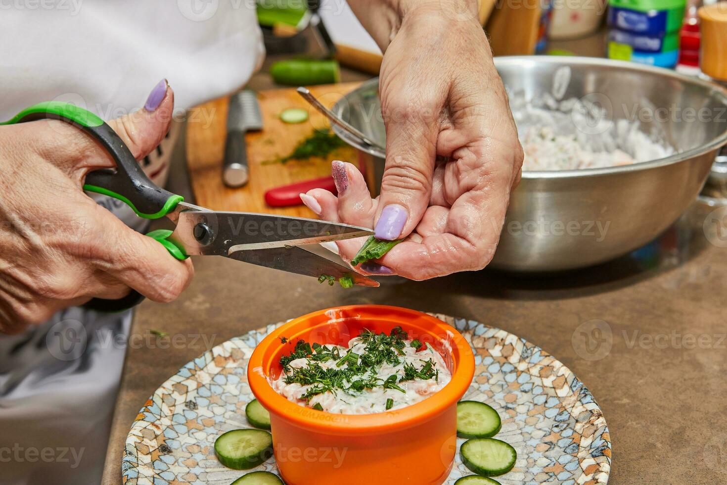 Chef preparing gourmet tartare with salmon and cheese on a plate photo