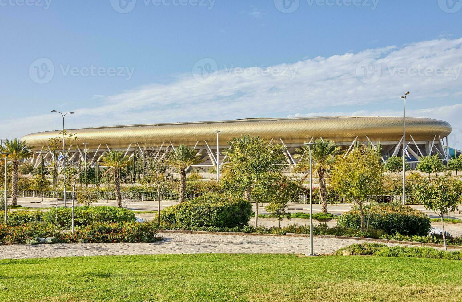 Scenic View of Sammy Offer Stadium Surrounded by Lush Green Grass and Trees in Haifa photo