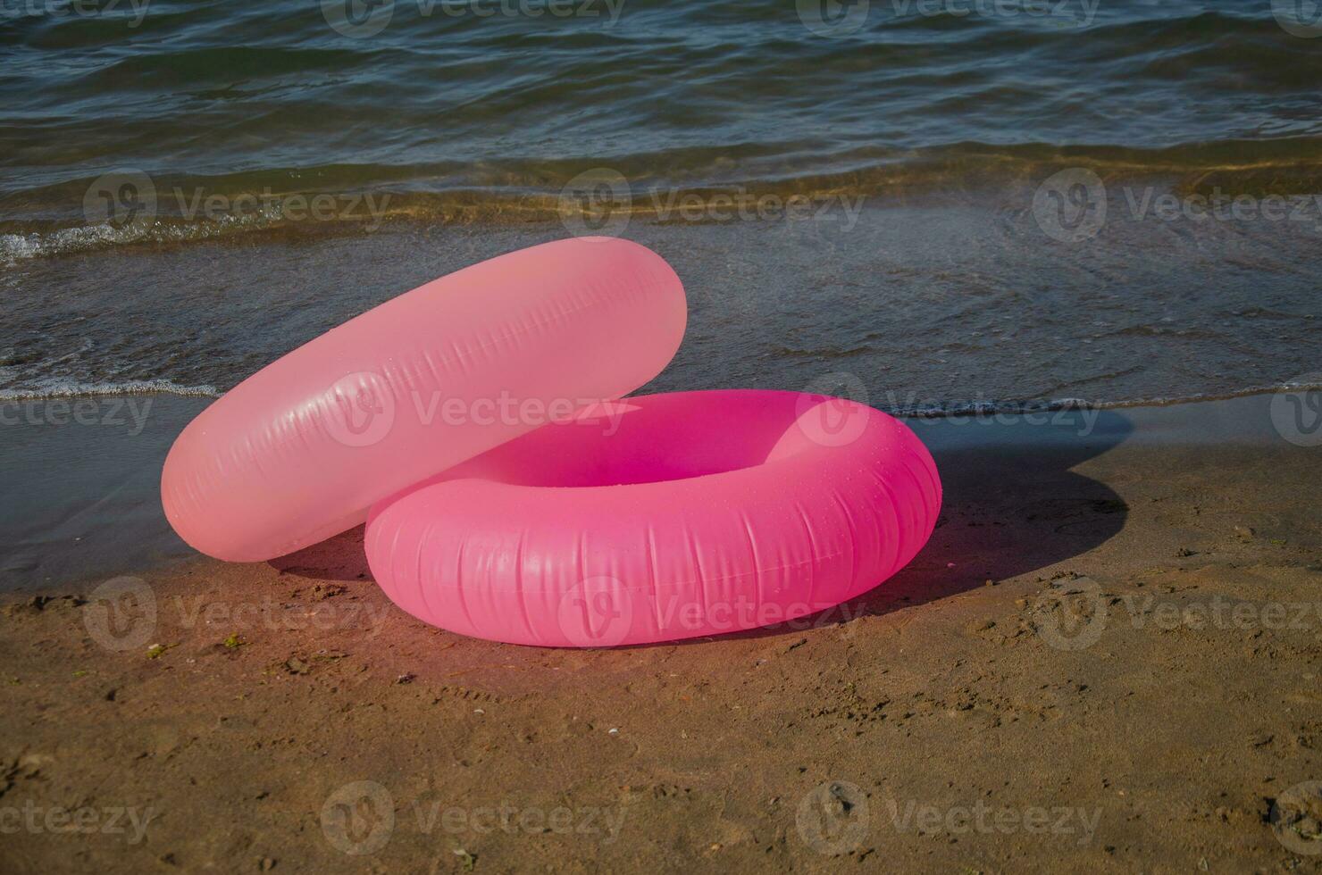 Children's swimming rings. Pink Inflatable Circles For Beach. photo