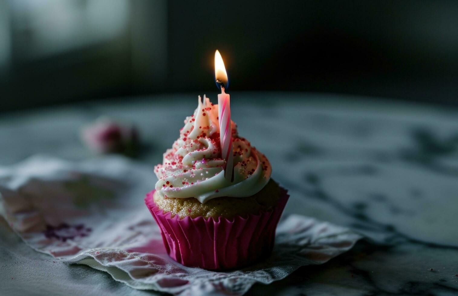 AI generated a pink cupcake with a birthday candle in pink and white photo