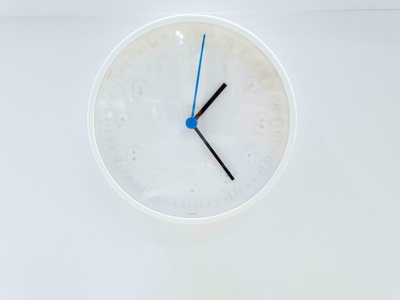 Closeup decorate modern white clock wall isolate on white background. photo