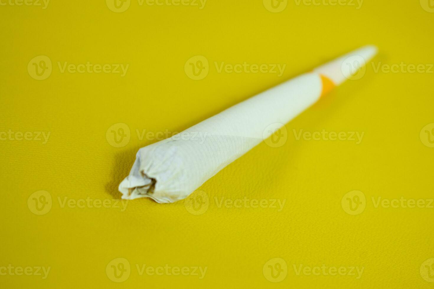 Close up cigarette handmade isolated on black background photo