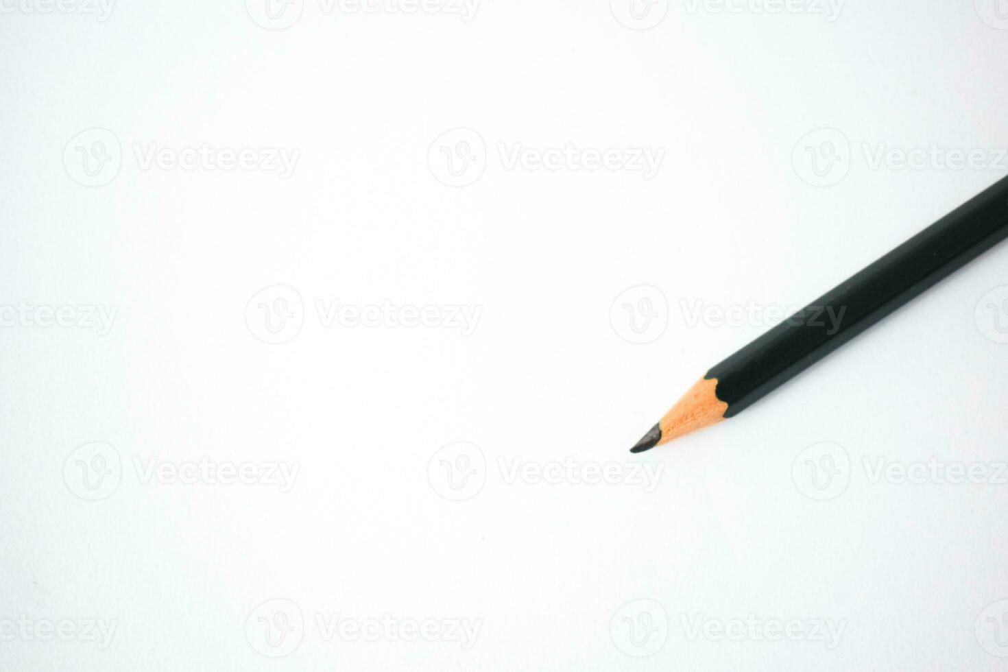 Black Green  pencil sharpened on white background photo