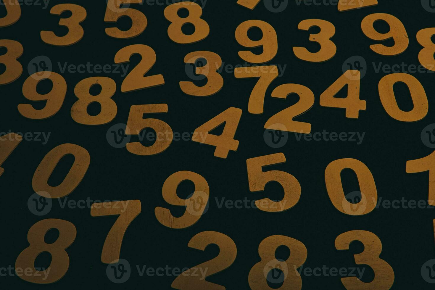 Wooden numbers on a black background. Numbers of different colors. photo