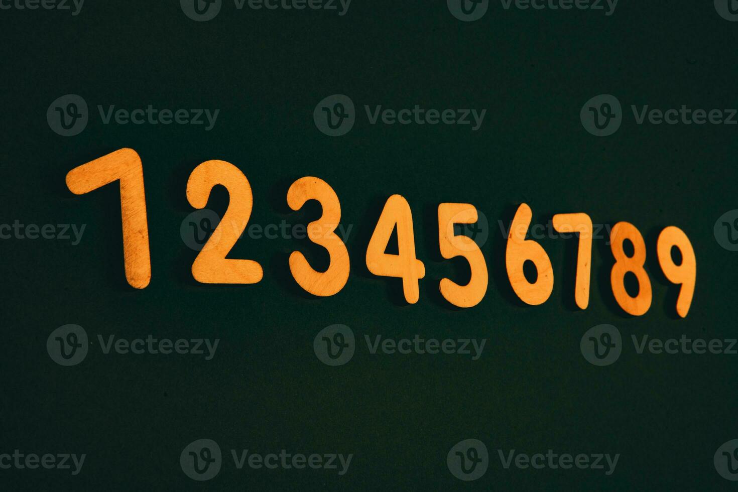 Colorful wooden numbers on black background. Number 1 to 9. photo
