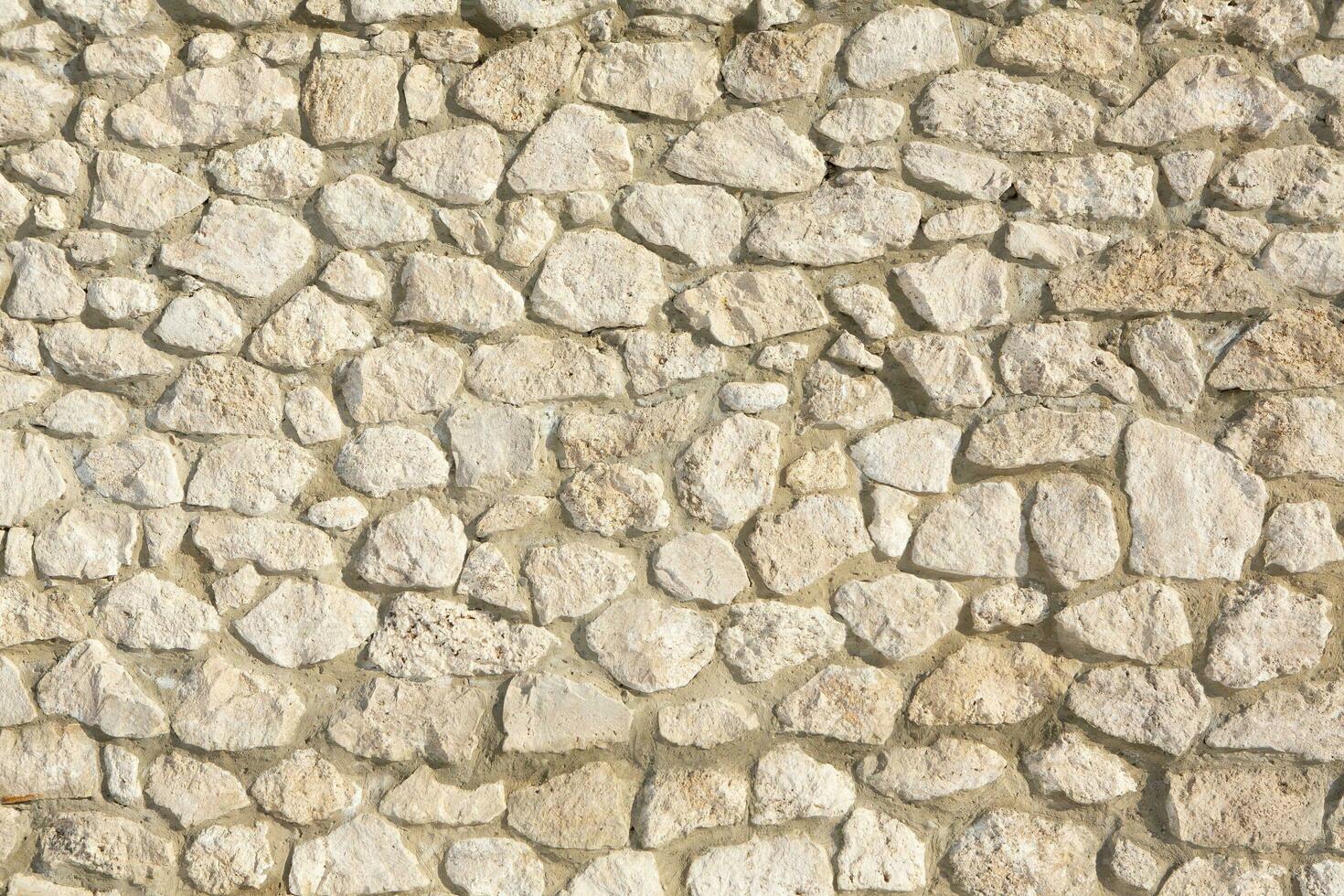 Background of stone wall texture photo. Close-up of stone wall. photo