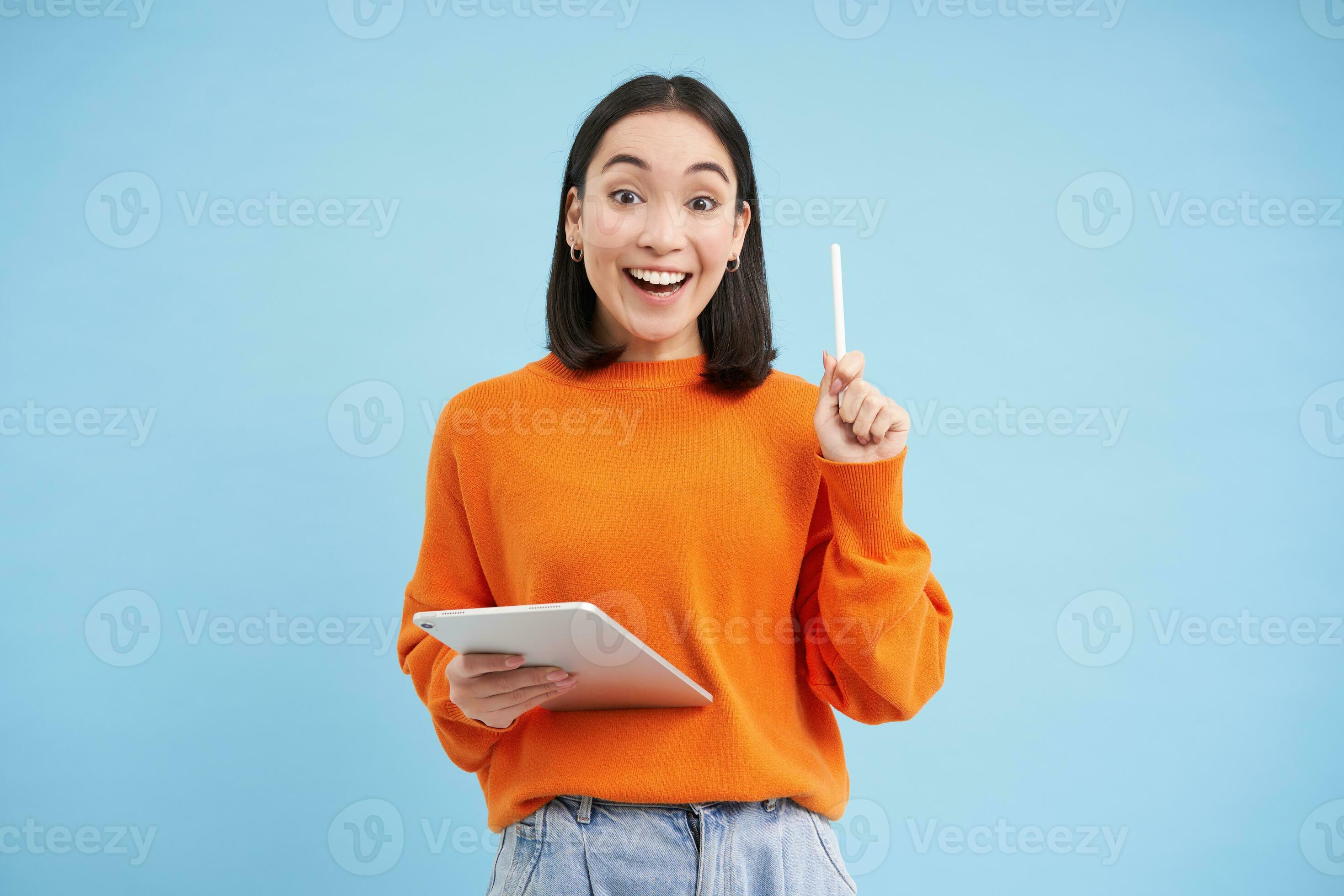 Eureka, got an idea. Excited asian woman with digital tablet, raising