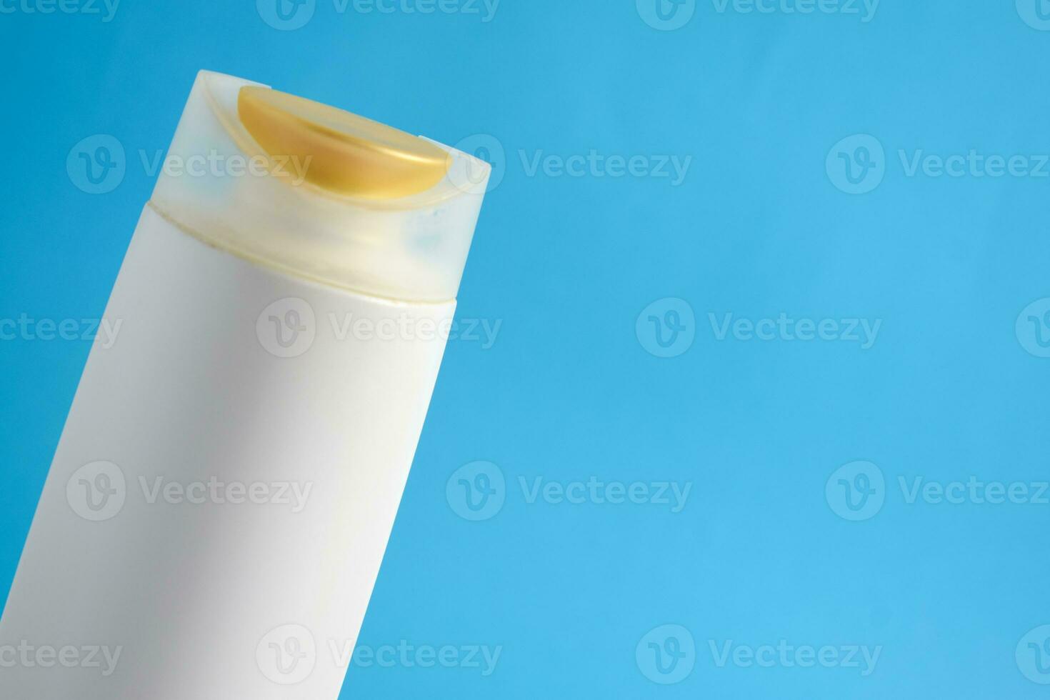 White Bottle shampoo blank for mock up with blue background, beauty health care mockup bottle. photo