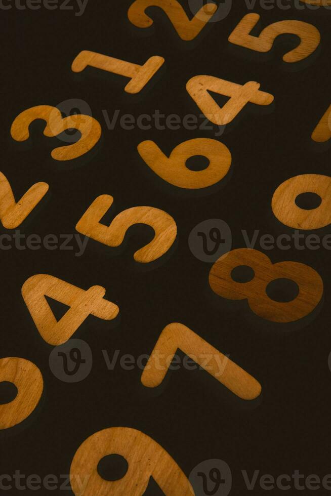 Numbers on a dark background. Seamless pattern. Toned. photo