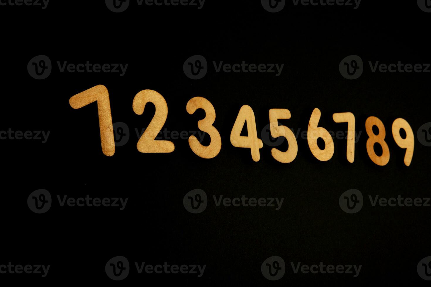 Colorful wooden numbers on black background. Number 1 to 9. photo