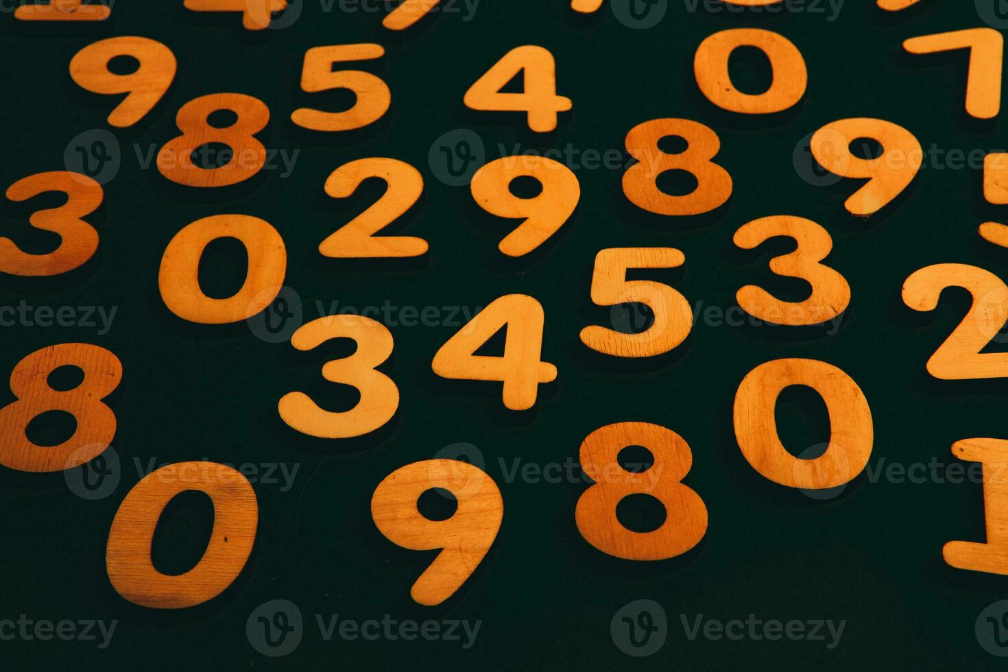 Wooden numbers on a black background. Numbers of different colors. photo