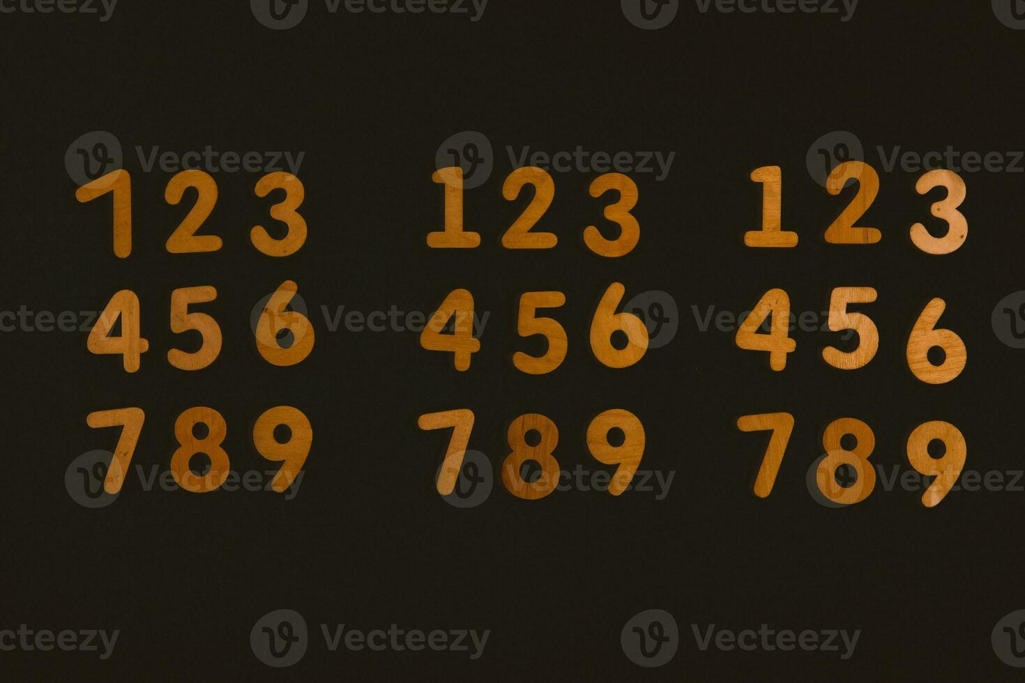 Colorful wooden numbers on black background. Number 1 to 9. photo