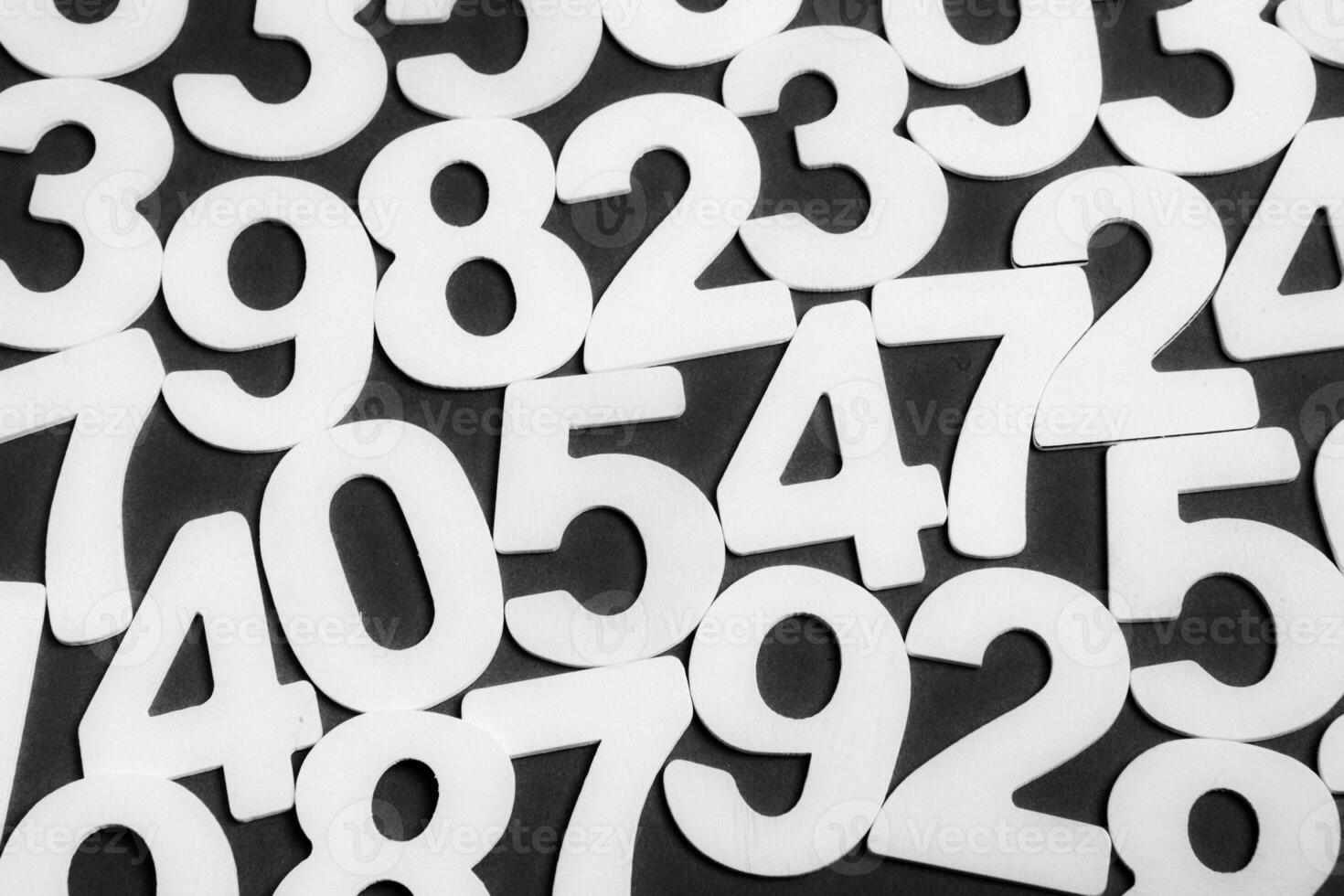 Colorful wooden numbers on a blackboard background with space for text photo