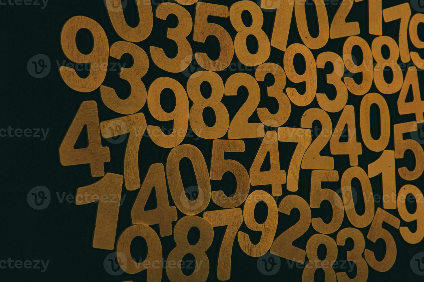 Wooden numbers on a black background. Numbers from zero to nine. photo
