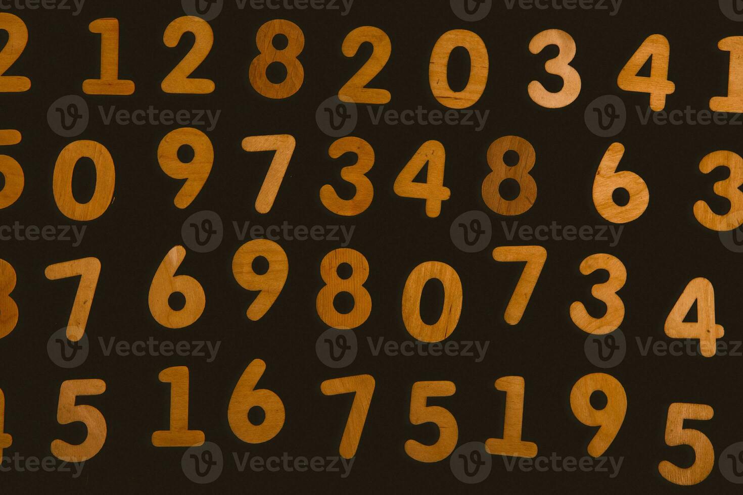 Wooden numbers on a black background. Numbers from zero to nine. photo