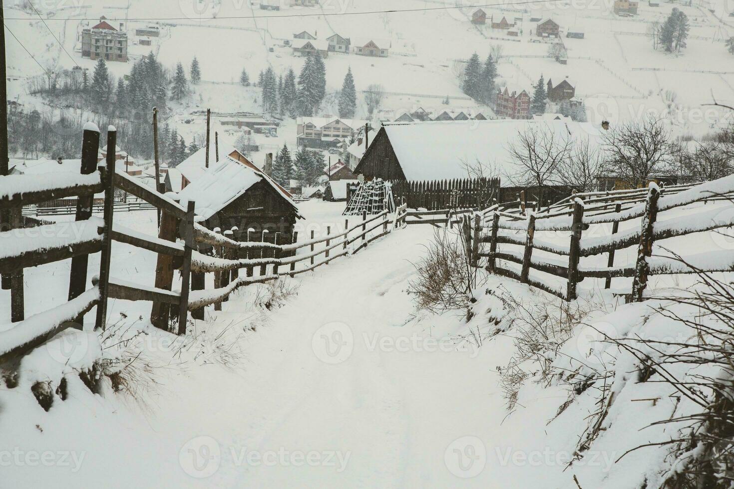 Panorama of the village in the winter mountains covered with snow. Winter landscape. The concept of freedom and solitude. photo