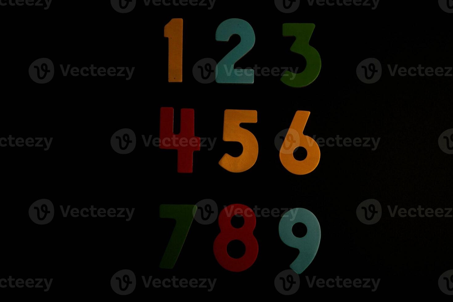 Colorful wooden numbers on black background. Number 1 to 9. photo