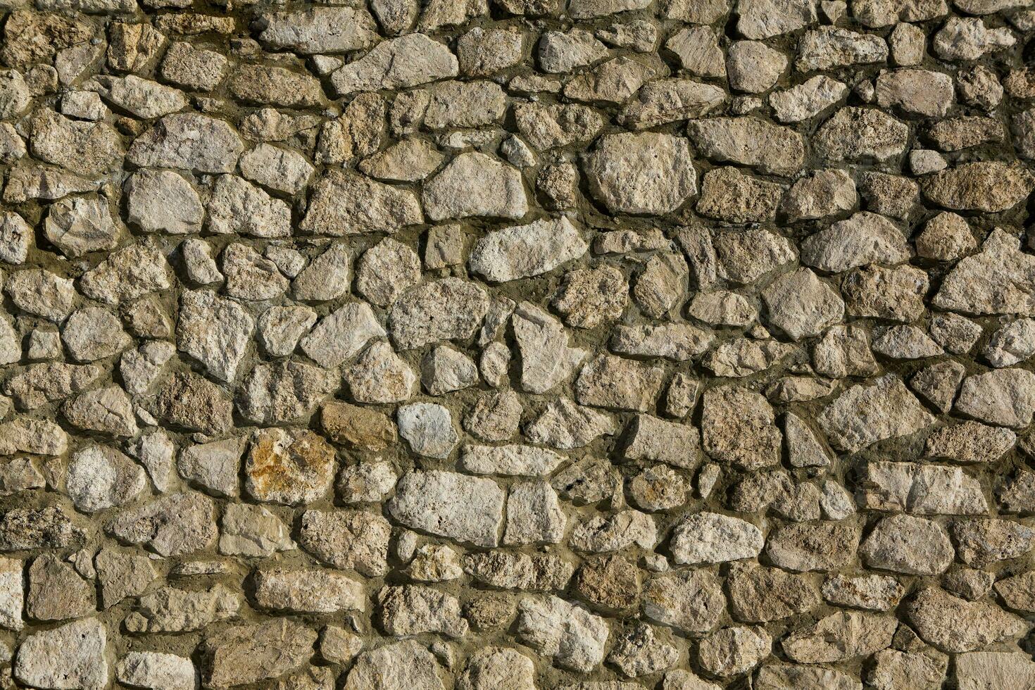 Background of stone wall texture photo. Close-up of stone wall. photo