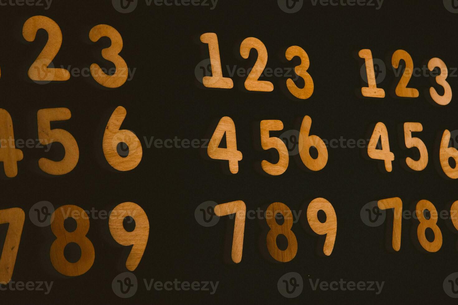 Colorful wooden numbers on black background. Number 1 to 9. photo