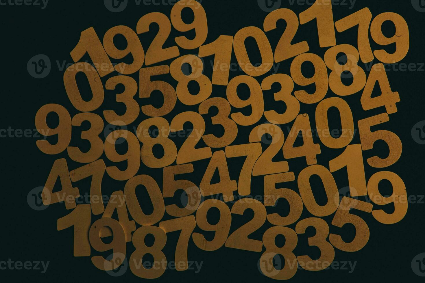 Colorful wooden numbers on a blackboard background with space for text photo