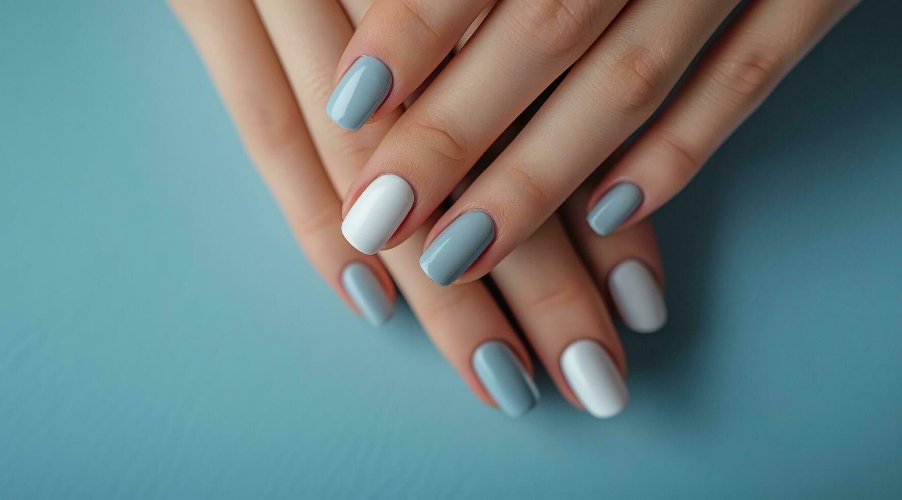 AI generated woman's hands with white and gray nail paint. photo