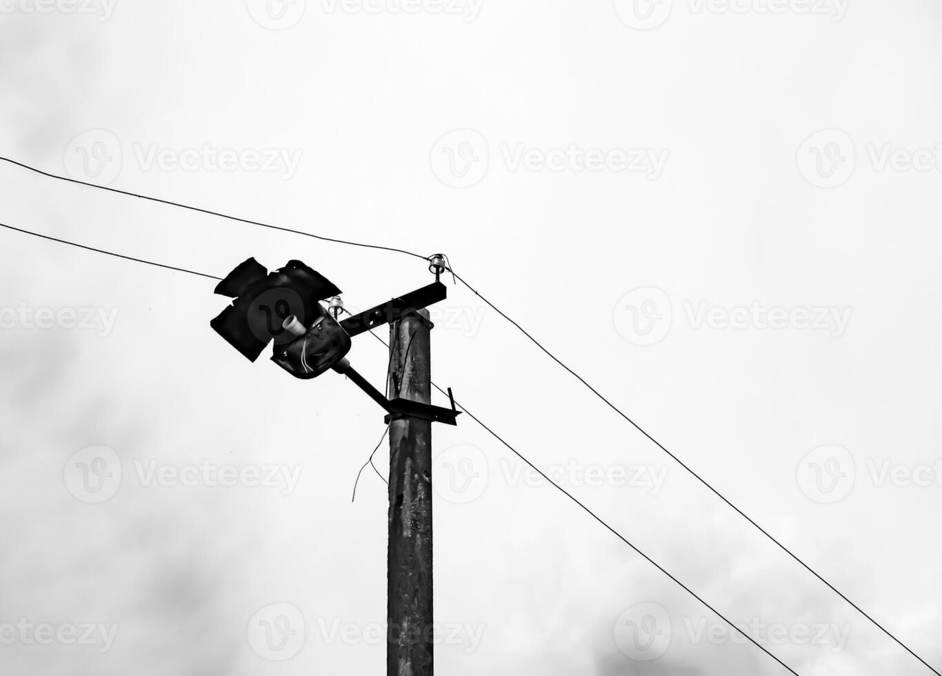 Power electric pole with line wire on light background close up photo