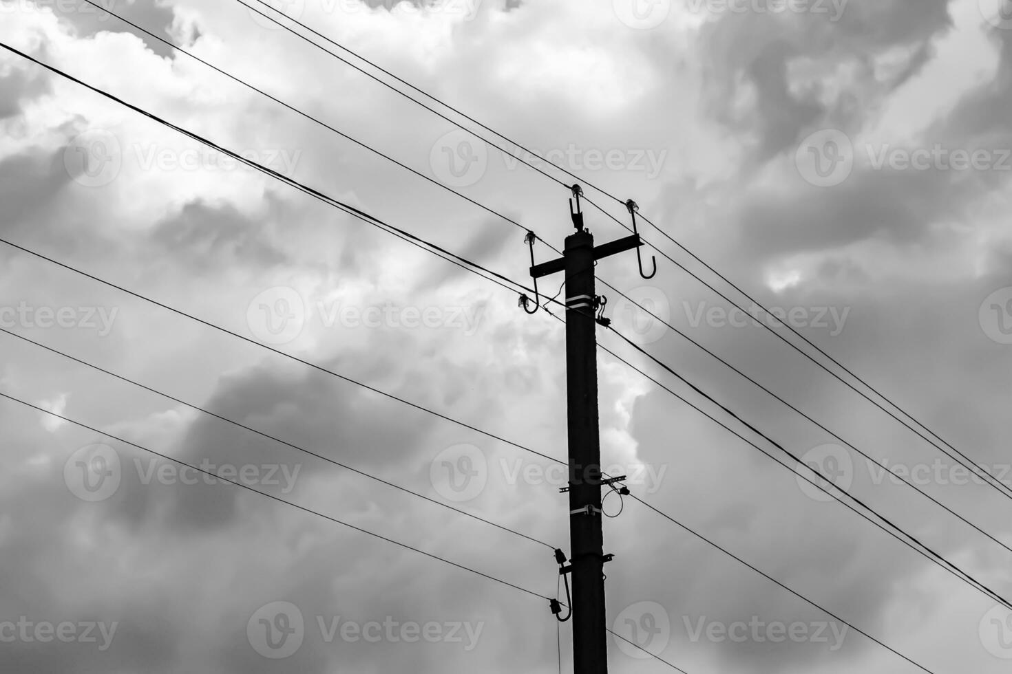 Power electric pole with line wire on light background close up photo