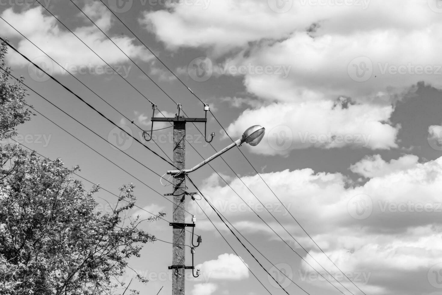 Power electric pole with line wire on light background close up photo