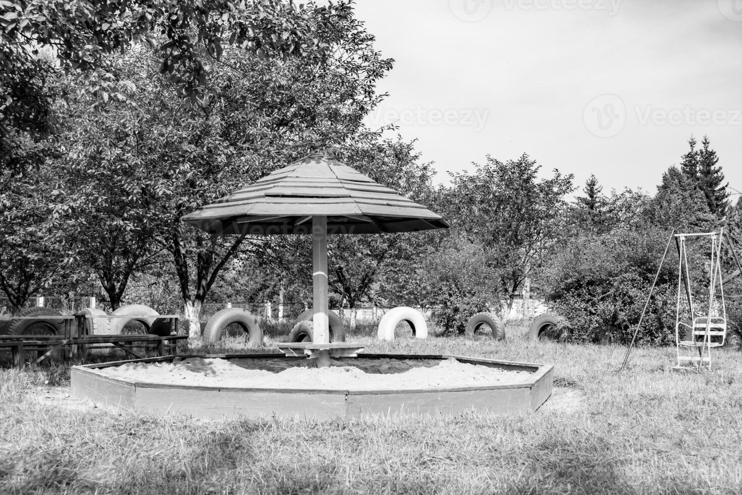 Photography on theme empty wooden sandbox with sand for kids photo