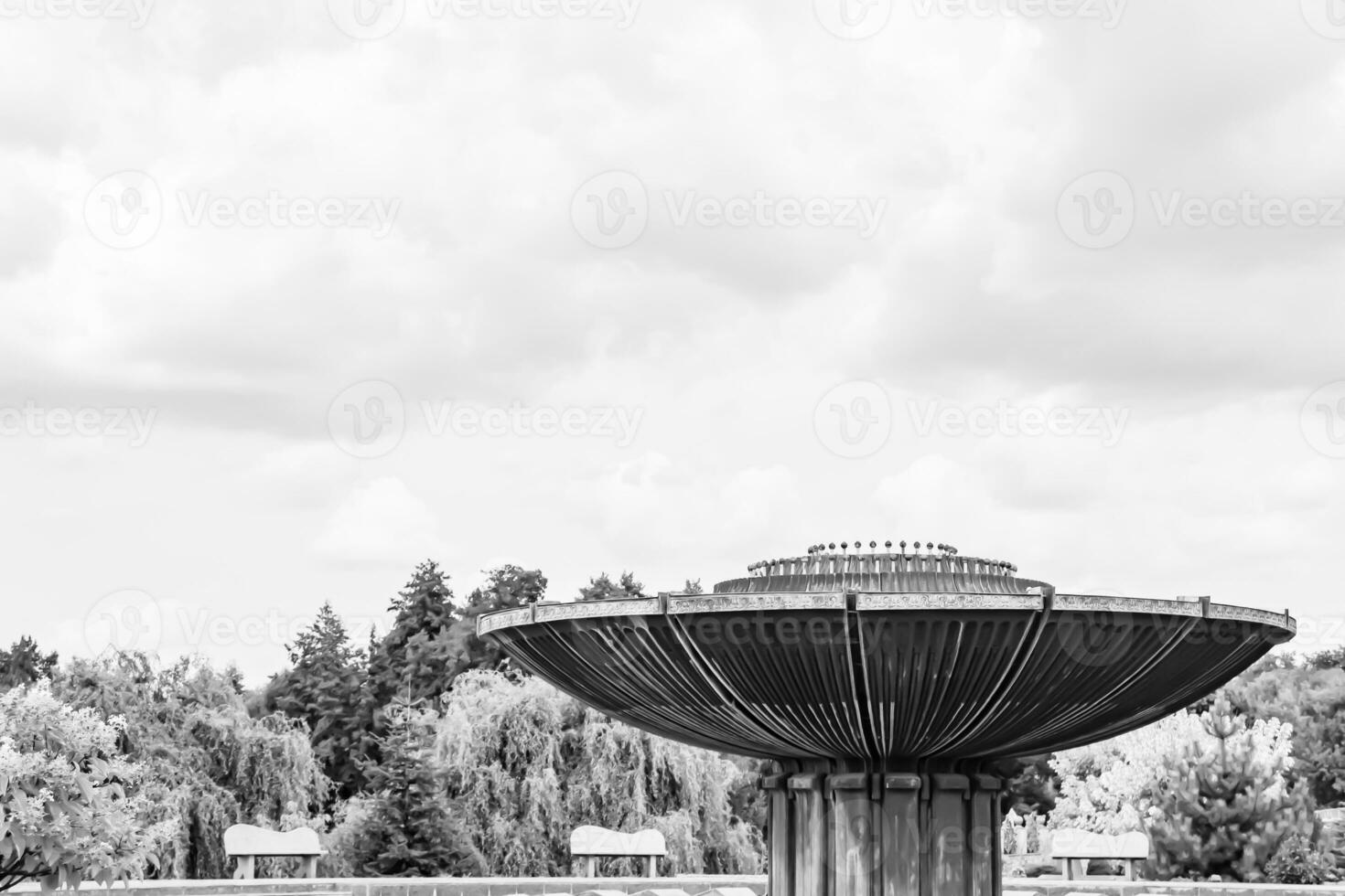 Photography on theme beautiful old fountain without water under clear sky photo