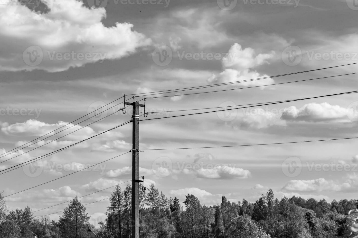 Power electric pole with line wire on light background close up photo